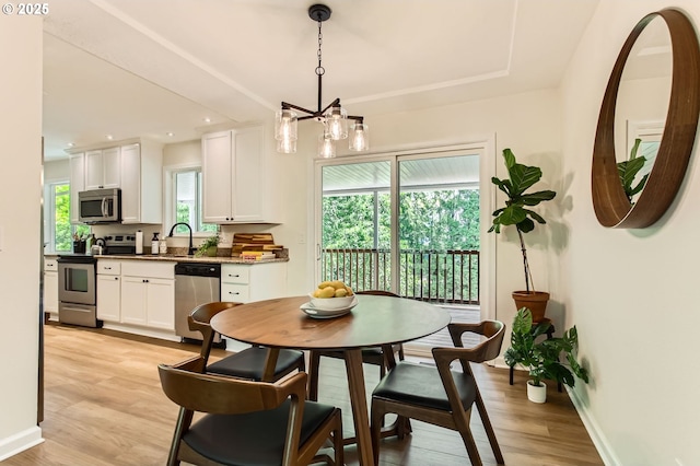 4080 SW 196th Ave, Beaverton, OR 97078 - dining room featuring light wood-type flooring, a chandelier, and recessed lighting