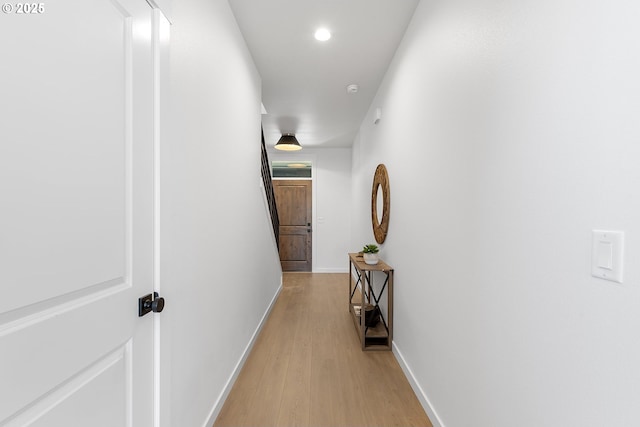 corridor featuring light hardwood / wood-style floors