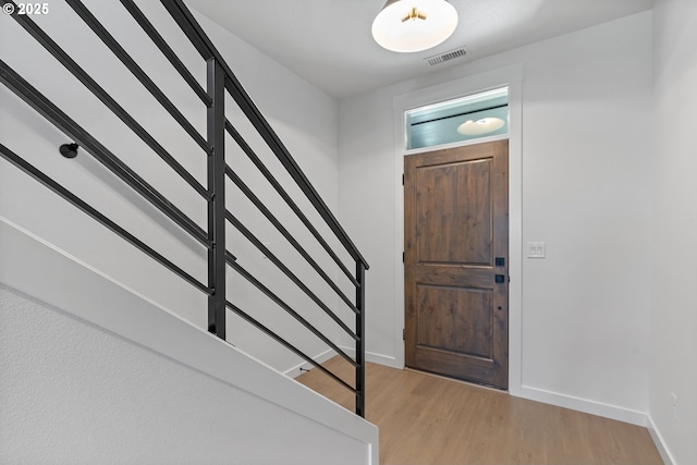 entrance foyer with light hardwood / wood-style flooring