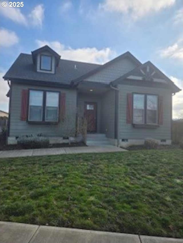 view of front facade featuring a front yard and crawl space