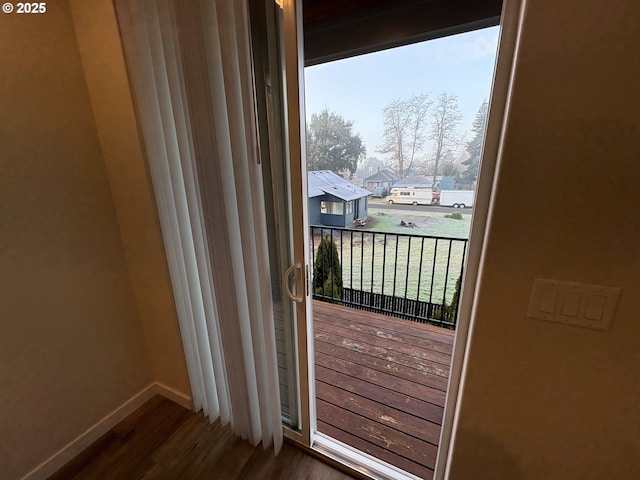 doorway featuring dark wood-type flooring