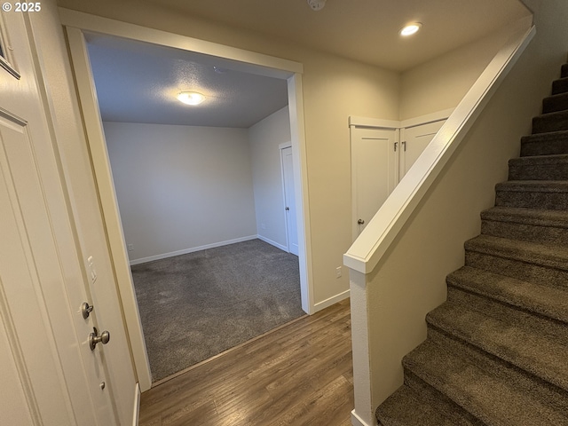 stairway with wood-type flooring