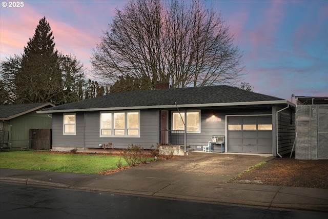 single story home featuring fence, aphalt driveway, roof with shingles, a yard, and an attached garage