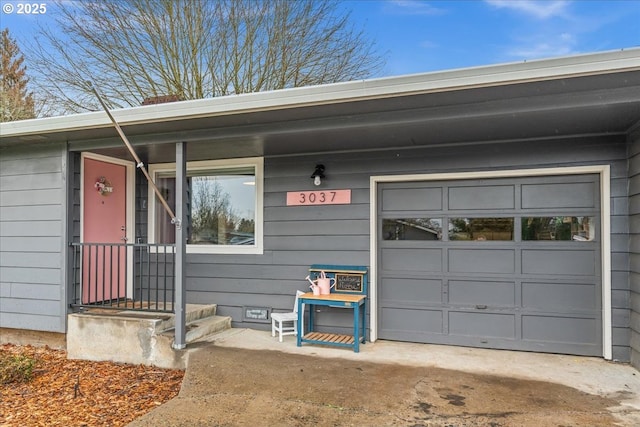 property entrance with a garage