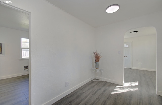 105 Redpath St, Kelso, WA 98626 - empty room with arched walkways, wood finished floors, and baseboards