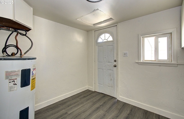 105 Redpath St, Kelso, WA 98626 - foyer entrance featuring water heater, dark wood-style flooring, and baseboards