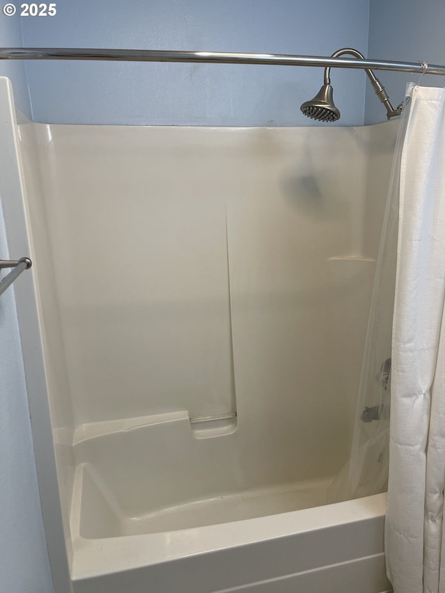 4970 S Landing Dr Unit 302, Portland, OR 97239 - bathroom featuring shower / bath combo with shower curtain