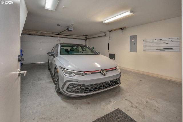 1634 NW Riverscape St, Portland, OR 97209 - garage featuring electric panel and a garage door opener
