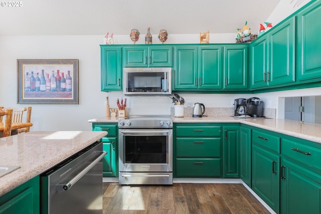461 Home Ct, Rockaway Beach, OR 97136 - kitchen featuring appliances with stainless steel finishes, dark wood-style floors, and light stone countertops