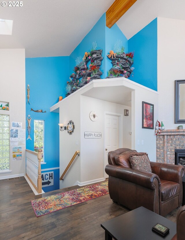 461 Home Ct, Rockaway Beach, OR 97136 - living area featuring high vaulted ceiling, wood finished floors, beamed ceiling, and a skylight
