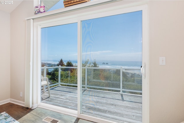 461 Home Ct, Rockaway Beach, OR 97136 - doorway to outside featuring wood finished floors and baseboards