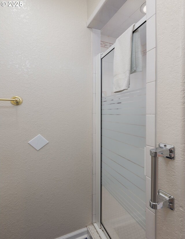 461 Home Ct, Rockaway Beach, OR 97136 - bathroom with a shower stall and a textured wall