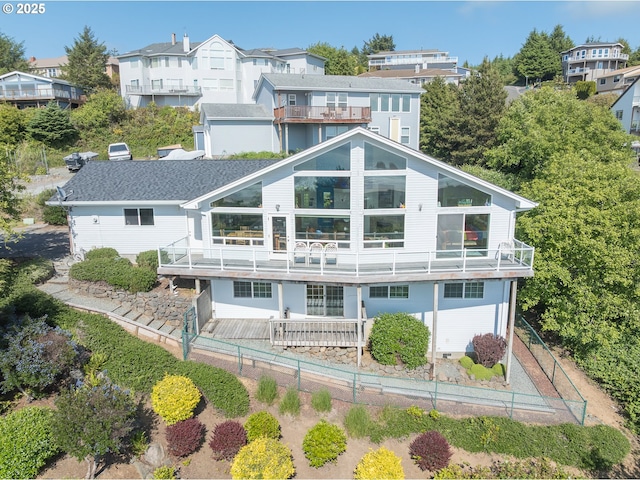 461 Home Ct, Rockaway Beach, OR 97136 - rear view of house featuring a residential view and a balcony