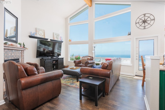 461 Home Ct, Rockaway Beach, OR 97136 - living area featuring a brick fireplace, high vaulted ceiling, dark wood-style floors, plenty of natural light, and beam ceiling