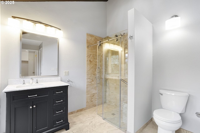 bathroom with vanity, toilet, and walk in shower