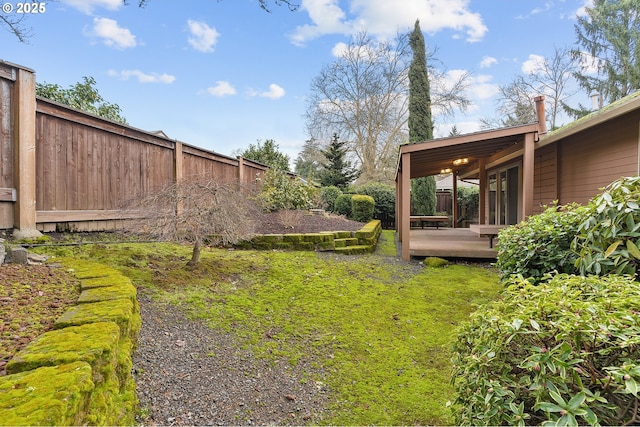 view of yard with a wooden deck