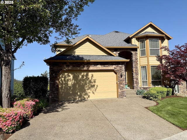 view of front of home featuring driveway, an attached garage, stone siding, and roof with shingles