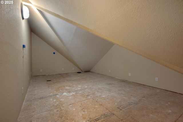 bonus room with vaulted ceiling