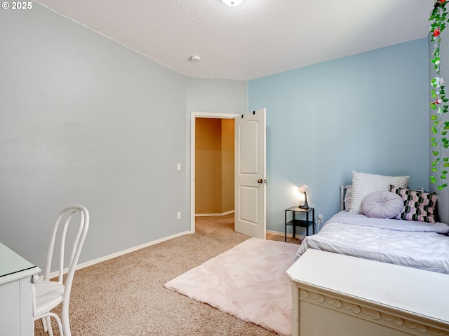 carpeted bedroom with baseboards