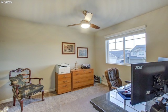 office with baseboards, light carpet, and ceiling fan