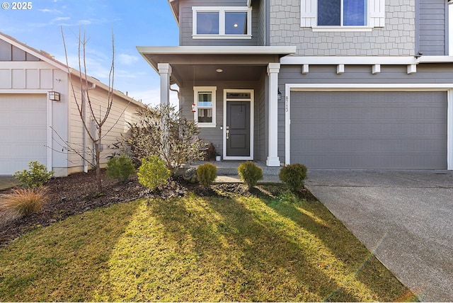 view of front of property with driveway, an attached garage, and a front yard