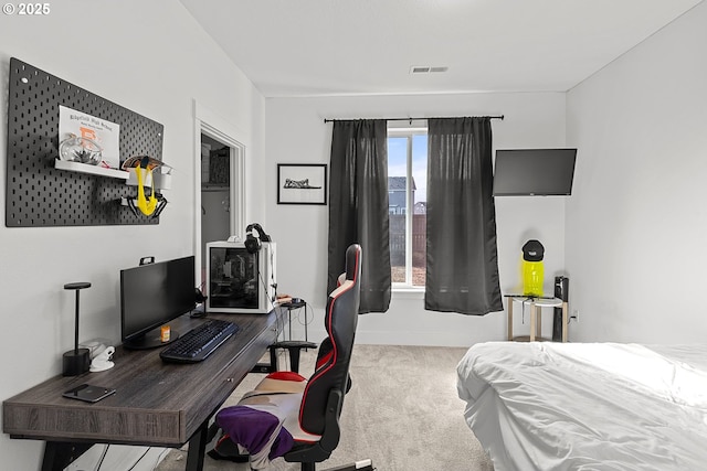 carpeted bedroom featuring visible vents