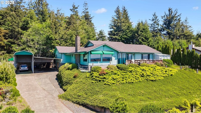 705 Prefontaine Dr, Coos Bay, OR 97420 - ranch-style house featuring a carport, concrete driveway, and a chimney