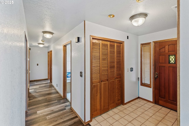 705 Prefontaine Dr, Coos Bay, OR 97420 - foyer entrance featuring a textured ceiling and baseboards