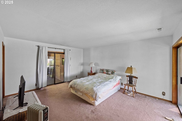705 Prefontaine Dr, Coos Bay, OR 97420 - bedroom featuring baseboards, carpet floors, a textured ceiling, and access to exterior