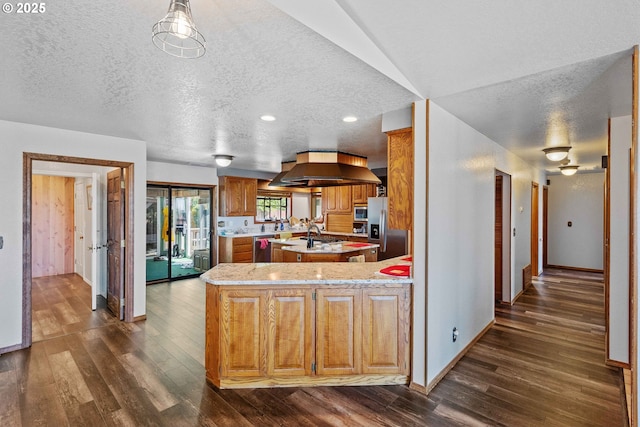 705 Prefontaine Dr, Coos Bay, OR 97420 - kitchen featuring dark wood finished floors, a kitchen island with sink, island range hood, baseboards, and stainless steel appliances