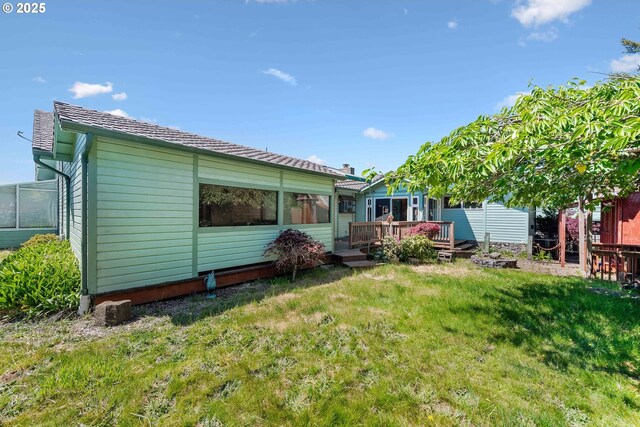 705 Prefontaine Dr, Coos Bay, OR 97420 - back of property with a wooden deck and a yard