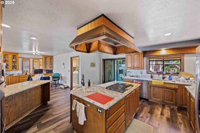 705 Prefontaine Dr, Coos Bay, OR 97420 - kitchen with appliances with stainless steel finishes, a textured ceiling, dark wood-style flooring, a sink, and light stone counters
