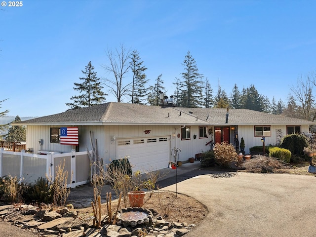 ranch-style home featuring a garage