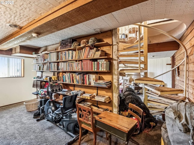 interior space with beam ceiling and carpet floors