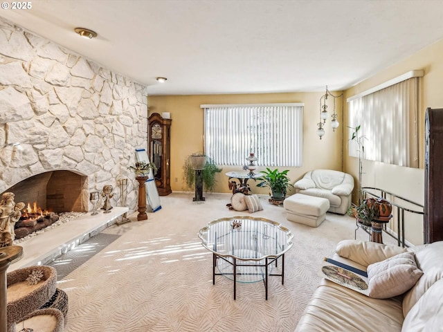 living room featuring light colored carpet and a fireplace