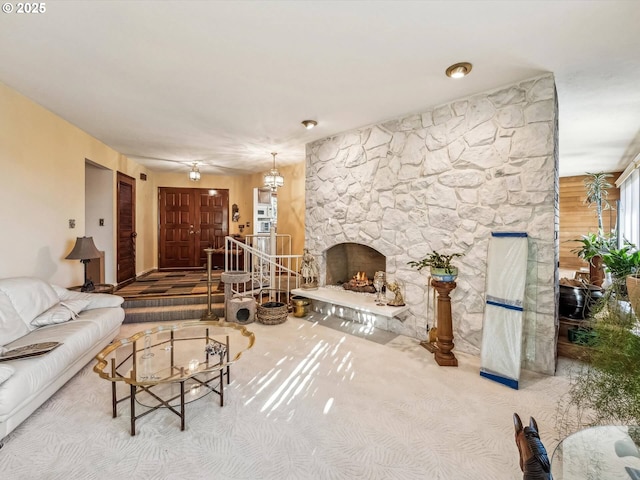 living room with carpet and a fireplace