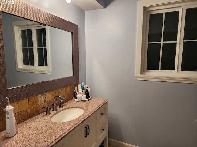 bathroom with vanity and backsplash