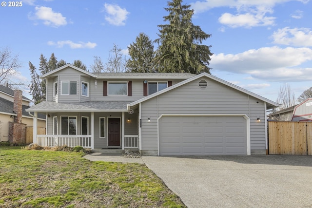 front facade with a garage, covered porch, and a front yard