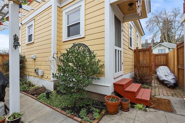 view of property exterior with fence