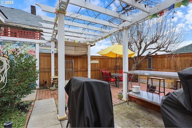 view of patio / terrace with outdoor dining area, a fenced backyard, a grill, and a pergola