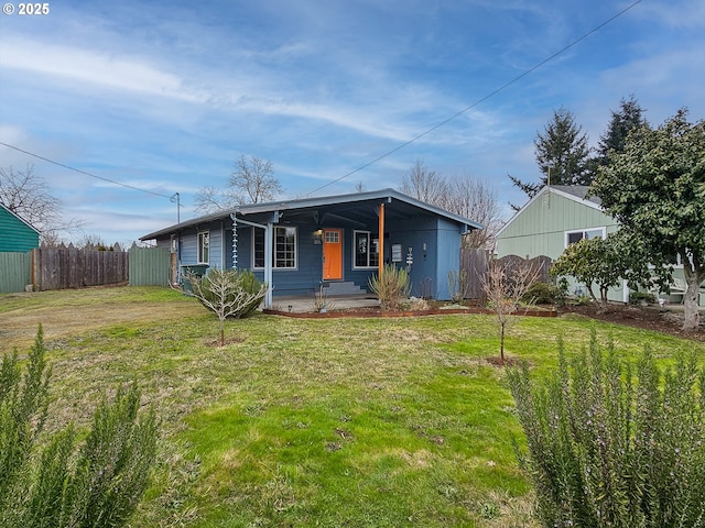 view of front of house featuring a front lawn and covered porch