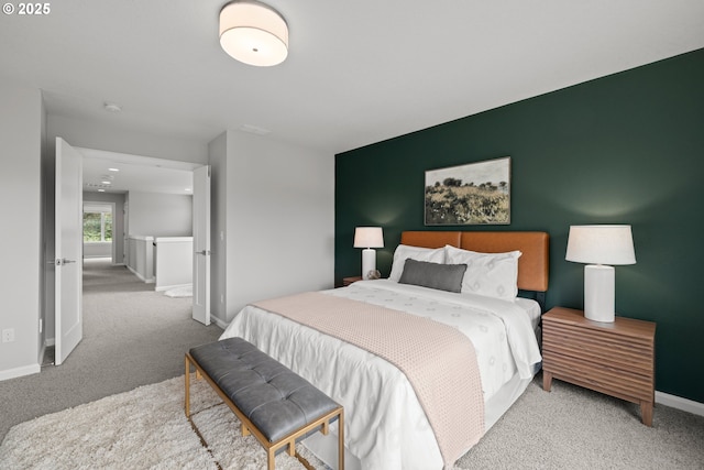 bedroom featuring baseboards and carpet flooring