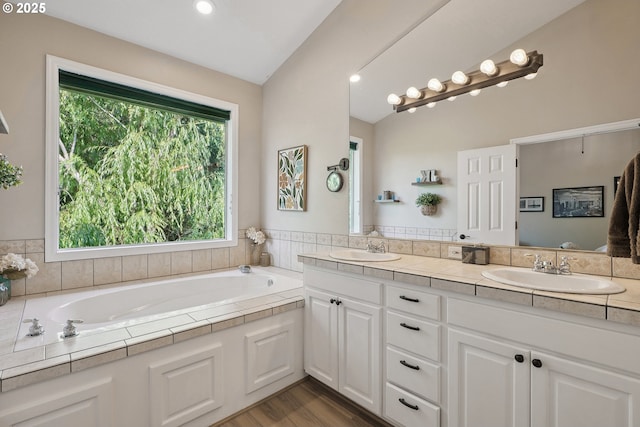 16117 SE Goosehollow Dr, Damascus, OR 97089 - bathroom with double vanity, a bath, wood finished floors, and recessed lighting
