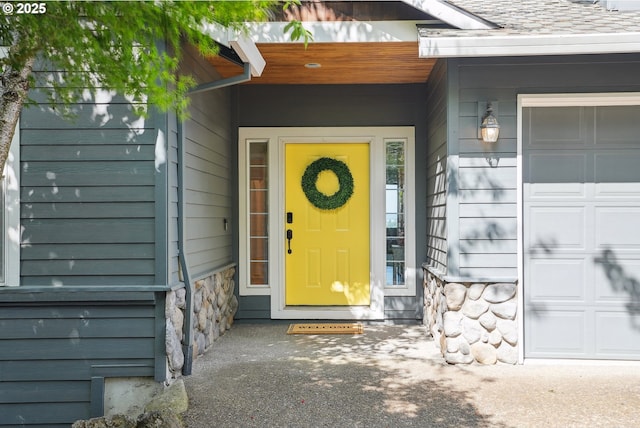 16117 SE Goosehollow Dr, Damascus, OR 97089 - doorway to property with stone siding and an attached garage