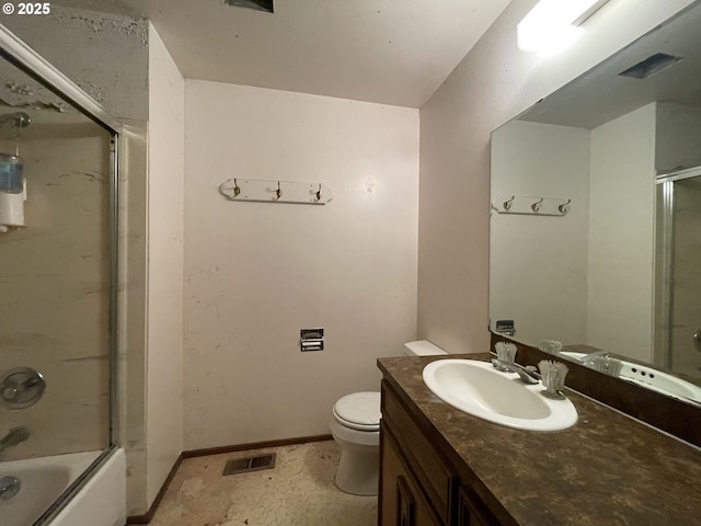 bathroom featuring toilet, vanity, bath / shower combo with glass door, and baseboards