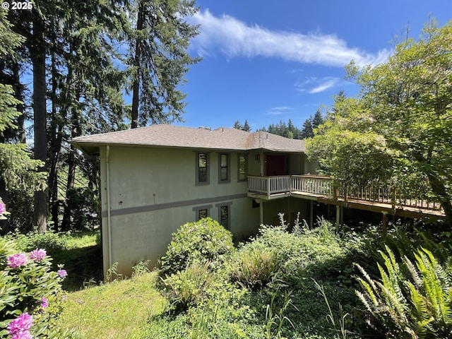 back of property with a deck