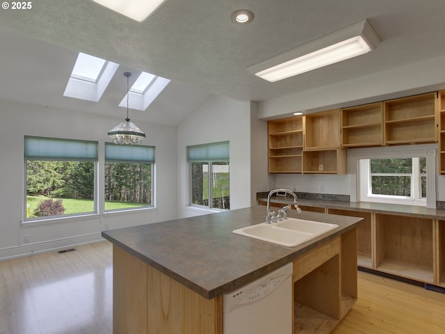 17234 Oakdale Rd, Dallas, OR 97338 - kitchen with a sink, lofted ceiling with skylight, dark countertops, visible vents, and dishwasher