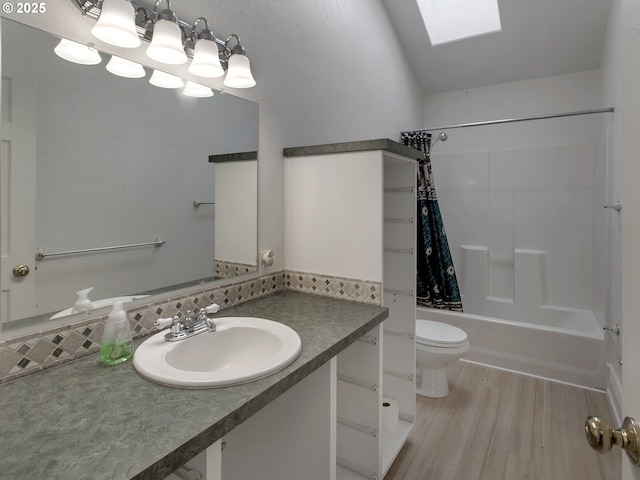 17234 Oakdale Rd, Dallas, OR 97338 - full bath with shower / bath combo, toilet, a skylight, wood finished floors, and vanity
