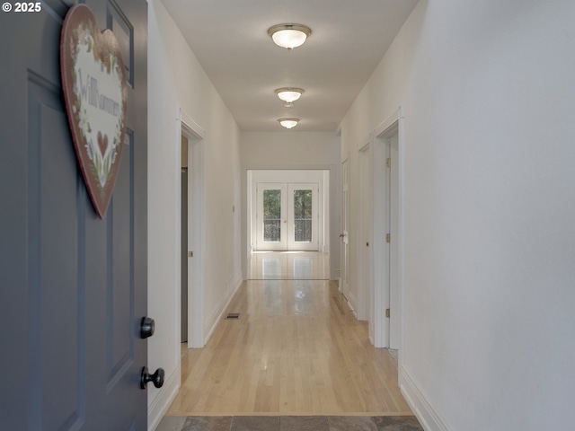 17234 Oakdale Rd, Dallas, OR 97338 - corridor with light wood-style floors, visible vents, baseboards, and french doors