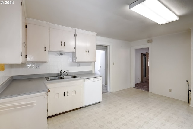 844 SE Cedar St, Hillsboro, OR 97123 - kitchen featuring white dishwasher, a sink, light floors, white cabinetry, and decorative backsplash